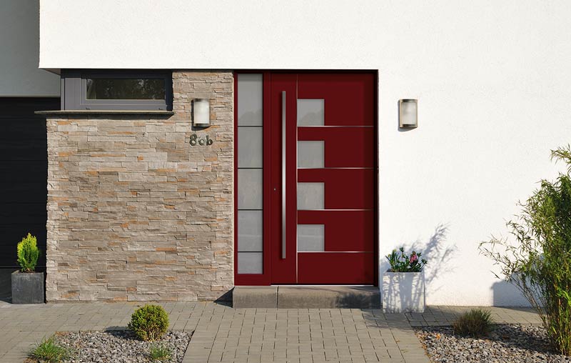 Installed modern red entrance door with frosted glass windows